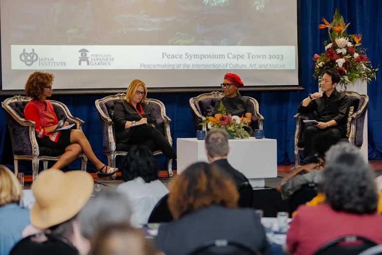People gathered on stage for a discussion in Cape Town for Japan Institute's Peace Symposium there. 